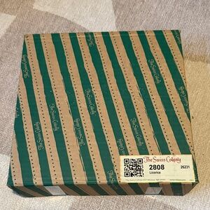 The Swiss Colony Licorice Variety Red and White Circular Tin NWT